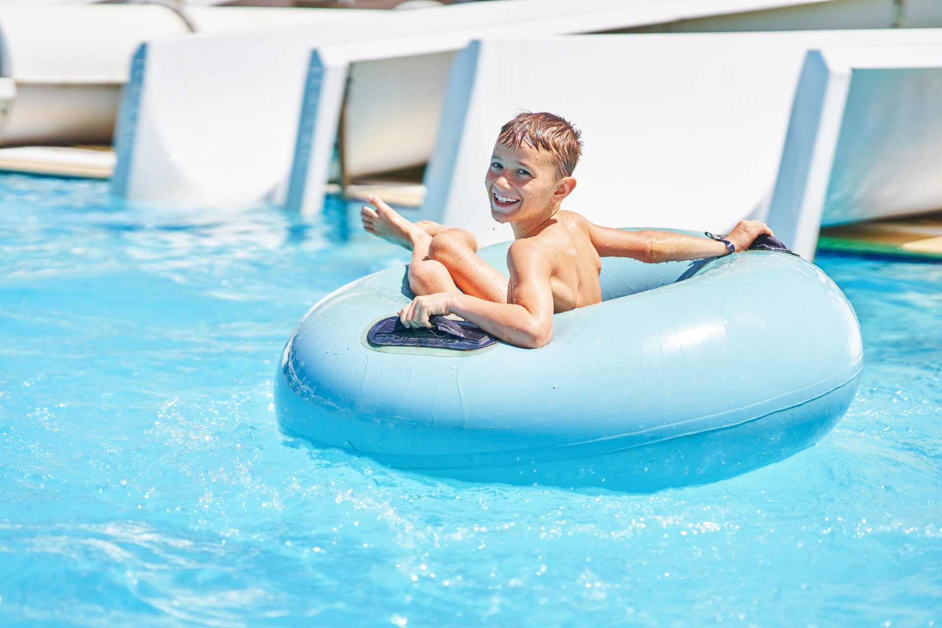 Picture of young boy playing in outdoor aqua park